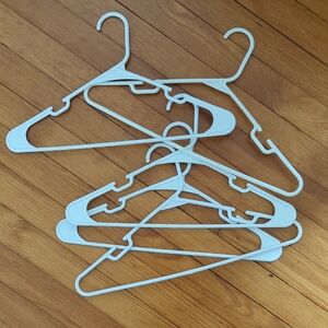 Set of White Plastic Hangers